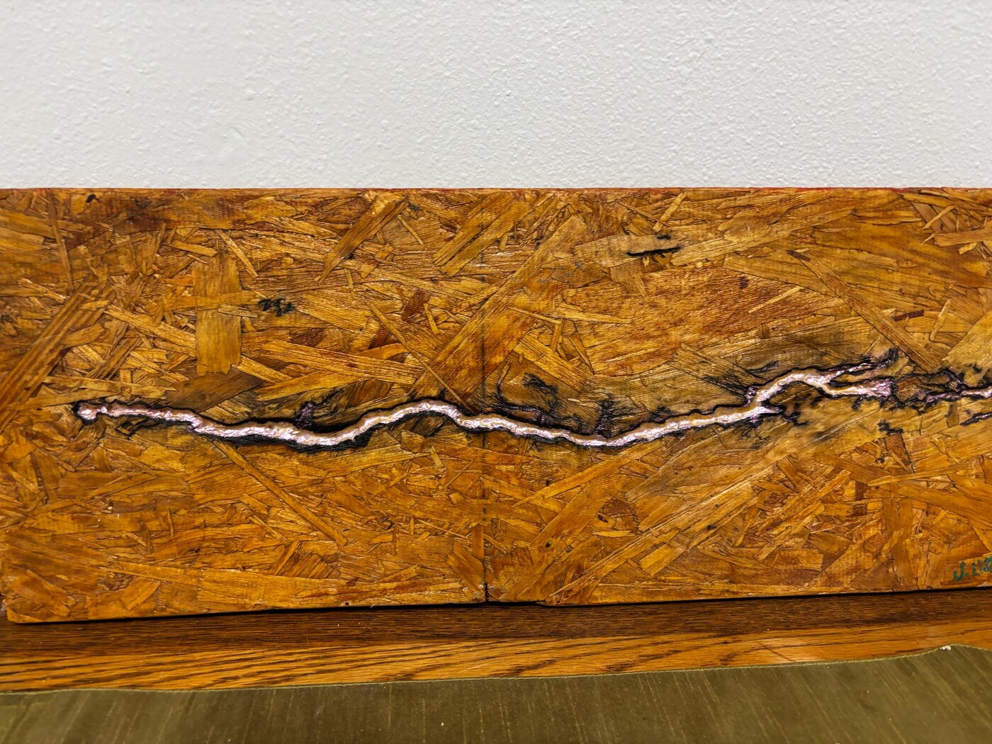 Horizontal wood panel with lightning-like fractal burning