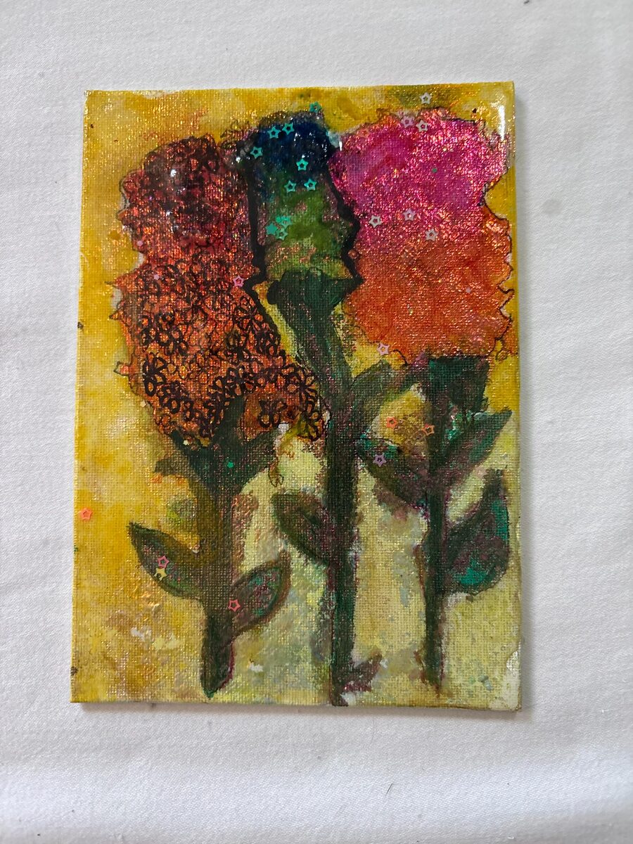 Small floral painting with orange and pink flowers on yellow background