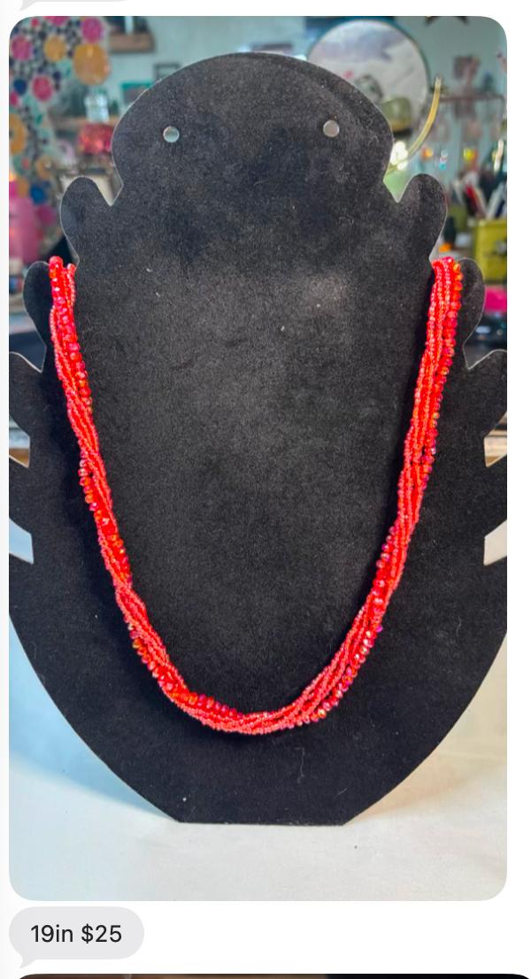 Red beaded 19 inch necklace on a black display bust