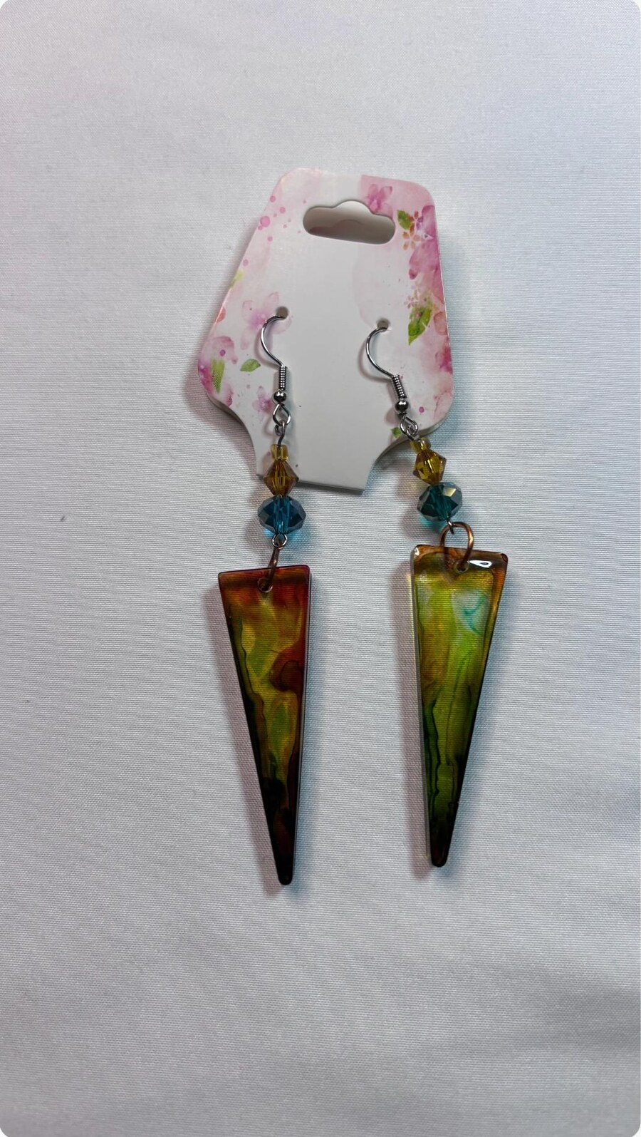 Amber green and teal long triangle handmade resin earrings with bead accents