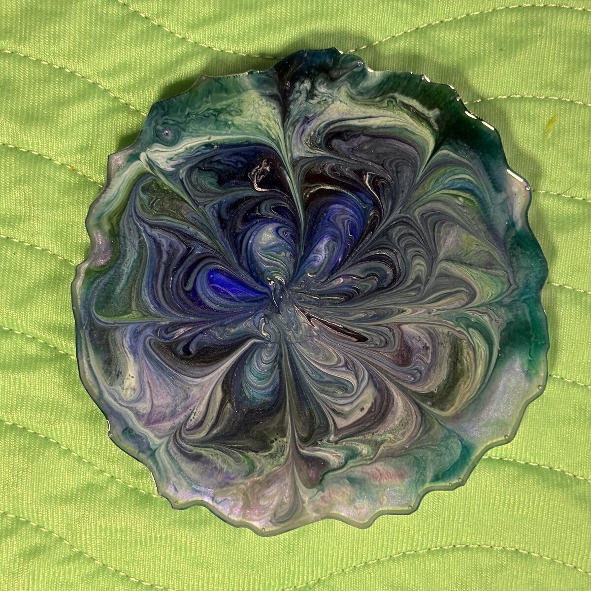 Blue and green scalloped resin dish with gray and purple swirls