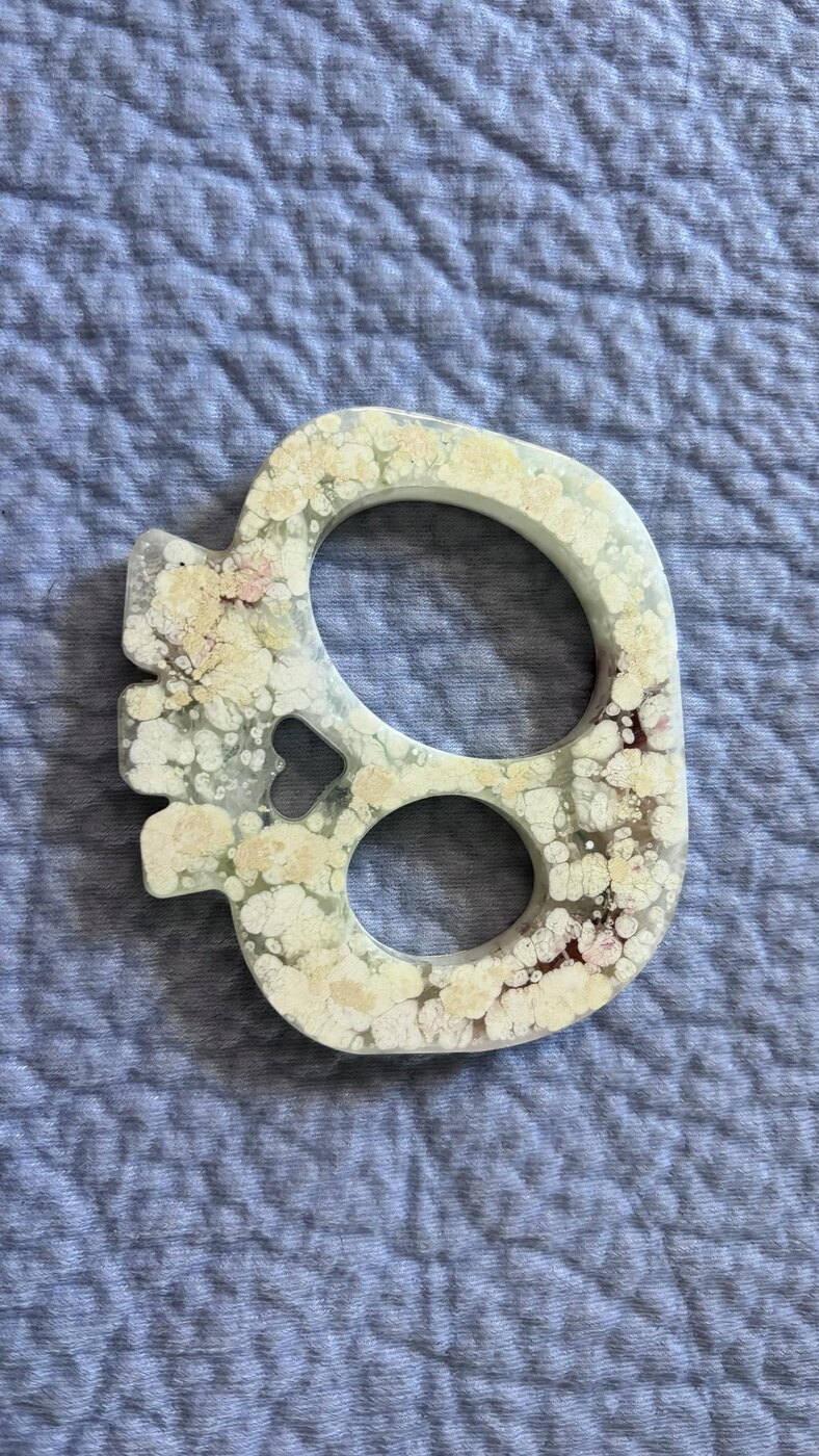 Cream and translucent handmade skull-shaped resin decor piece