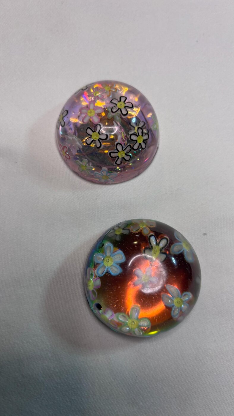 Two floral handmade resin domes