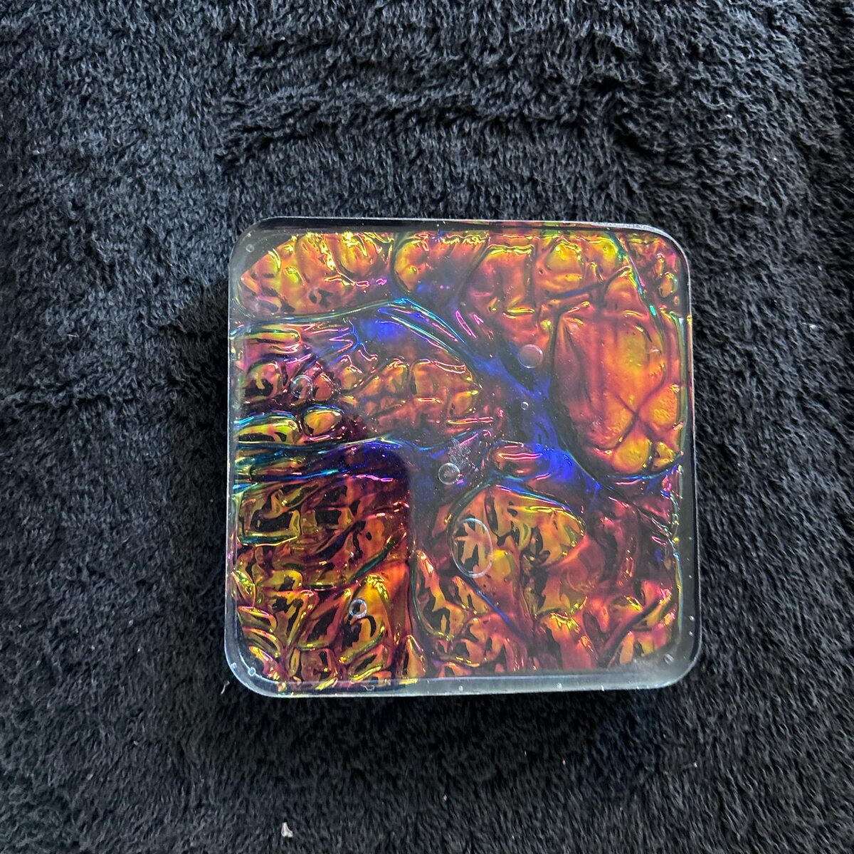 Iridescent square resin coaster with leaf pattern