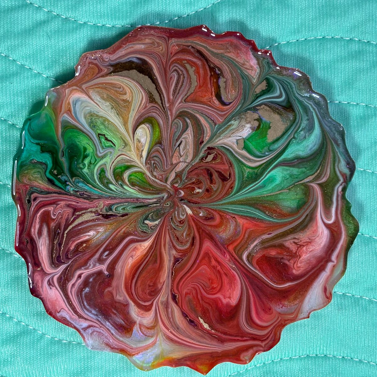 Multicolor scalloped resin dish with green, pink, and orange swirls