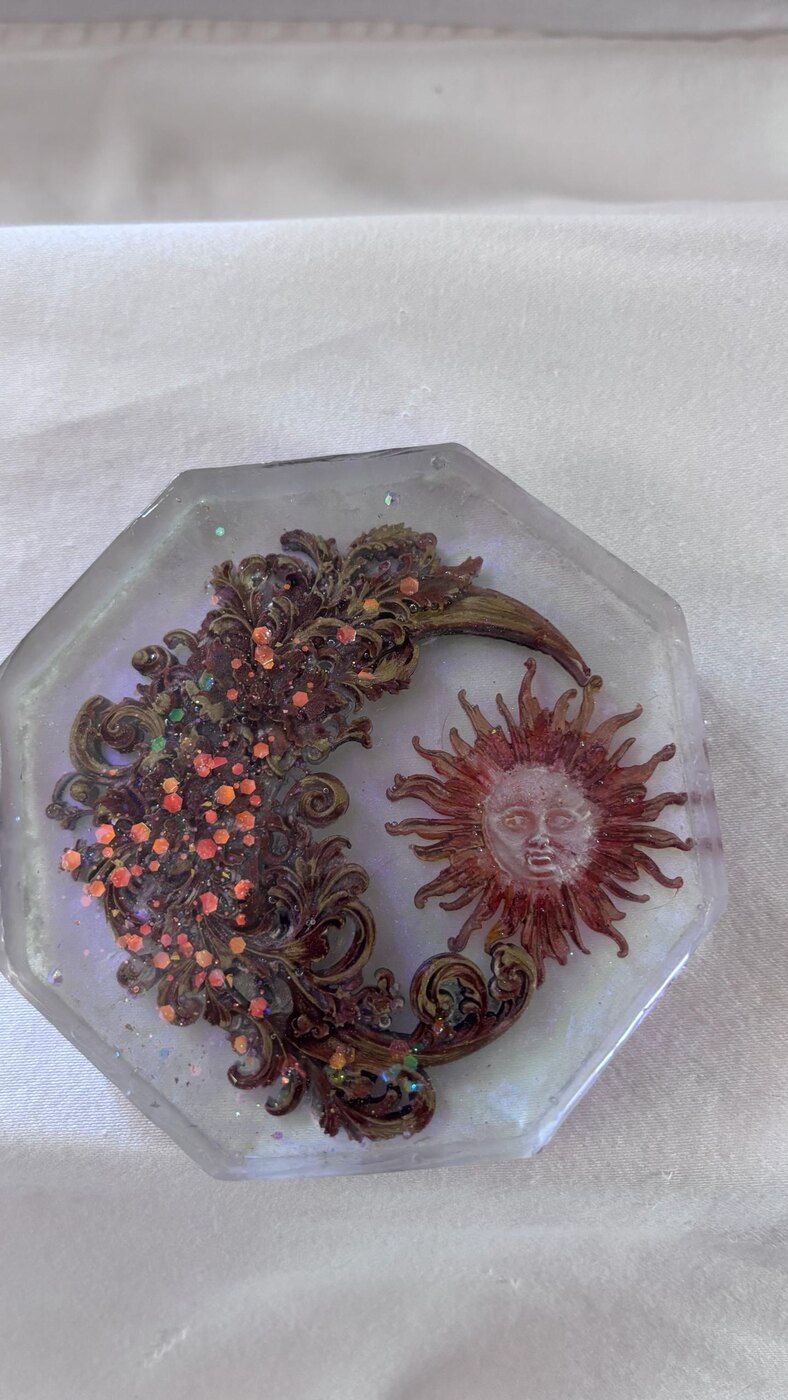 Handmade octagon resin coaster with moon, sun, and glitter details