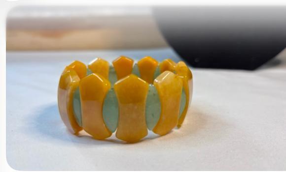 Yellow and green stretch bracelet with glossy stone panels